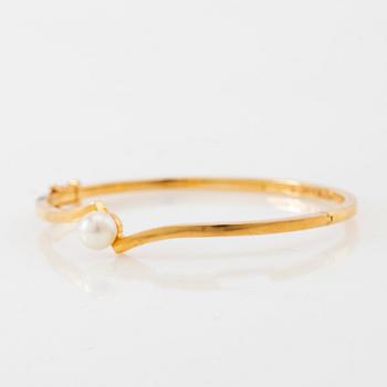 Armring, 18K guld och pärla, Stigbert, Stockholm, 1964.