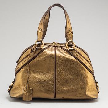 YVES SAINT LAURENT, a metallic bag.
