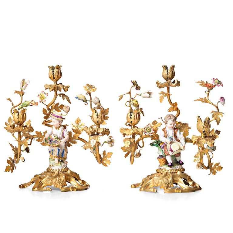 A pair of Meissen Rococo-style three-light candelabra, second half of the 1800's.