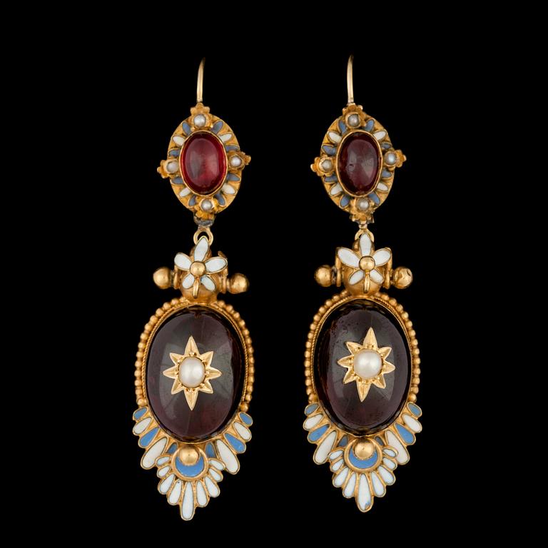 A pair of cabochon cut garnet earrings.