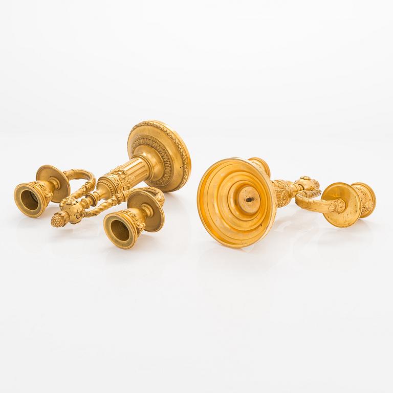 A. Rislef & Carré, a pair of brass candelabra, Paris, around 1900.