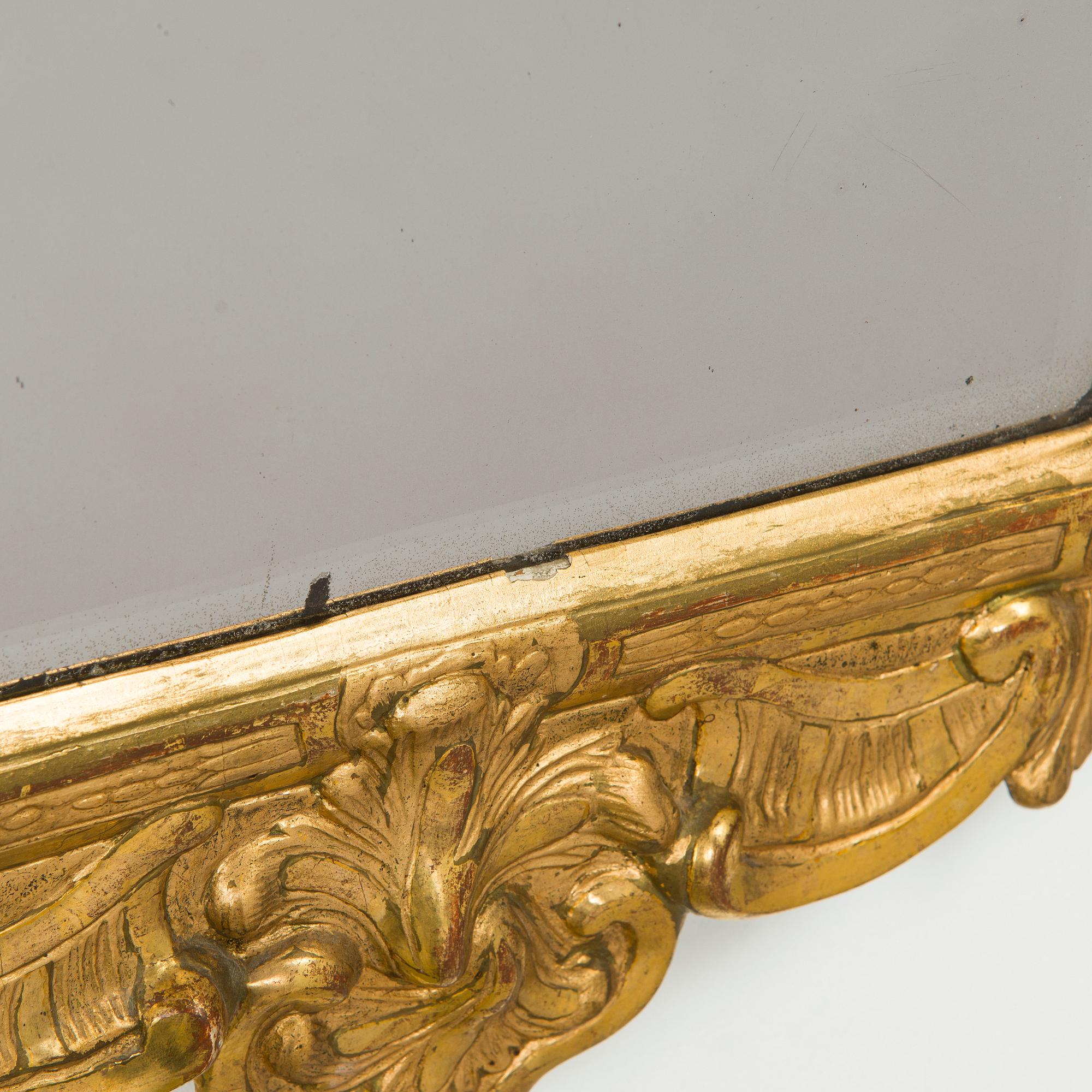 A Rococo giltwood mirror by Nils Meunier (master in Stockholm 1754-97, royal court mirror maker 1769).