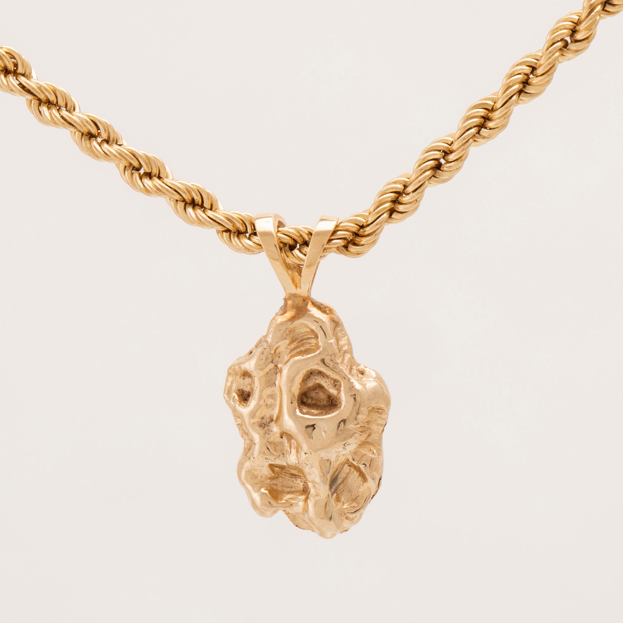 Halsband 14K guld med hänge i form av en guldklimp (nugget).