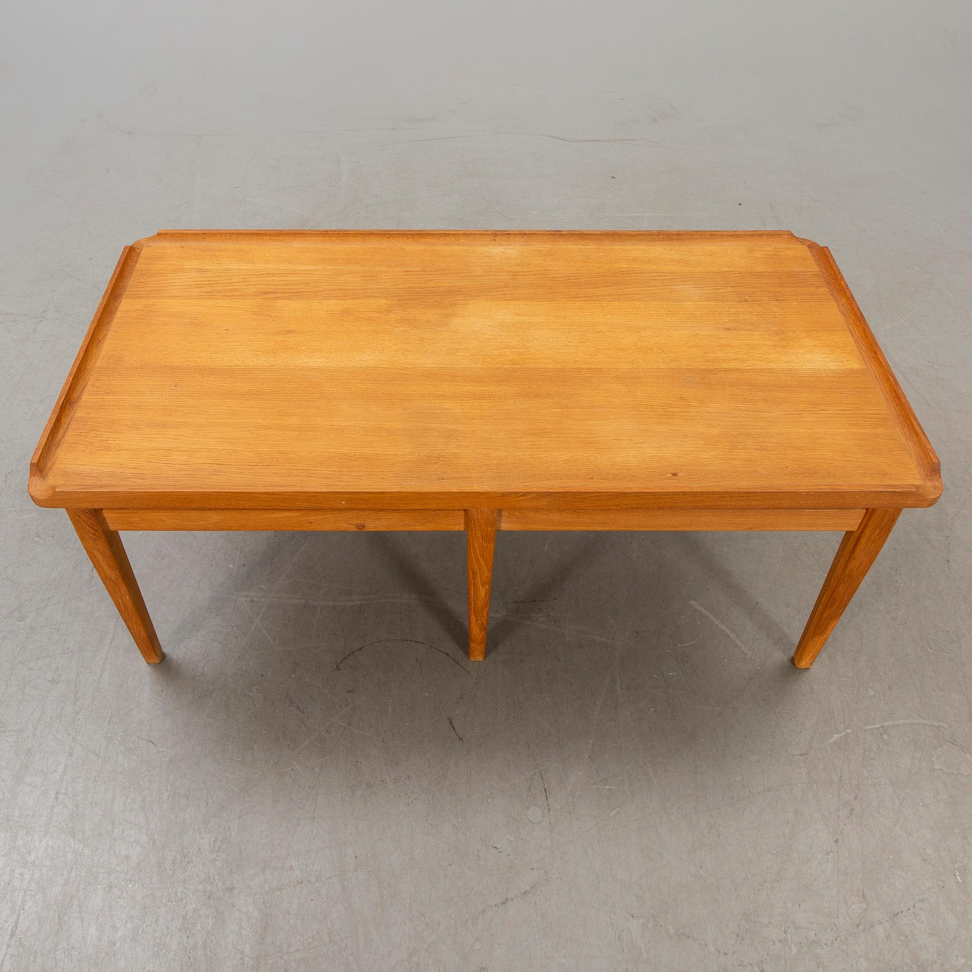 A 1960s oak coffee table.