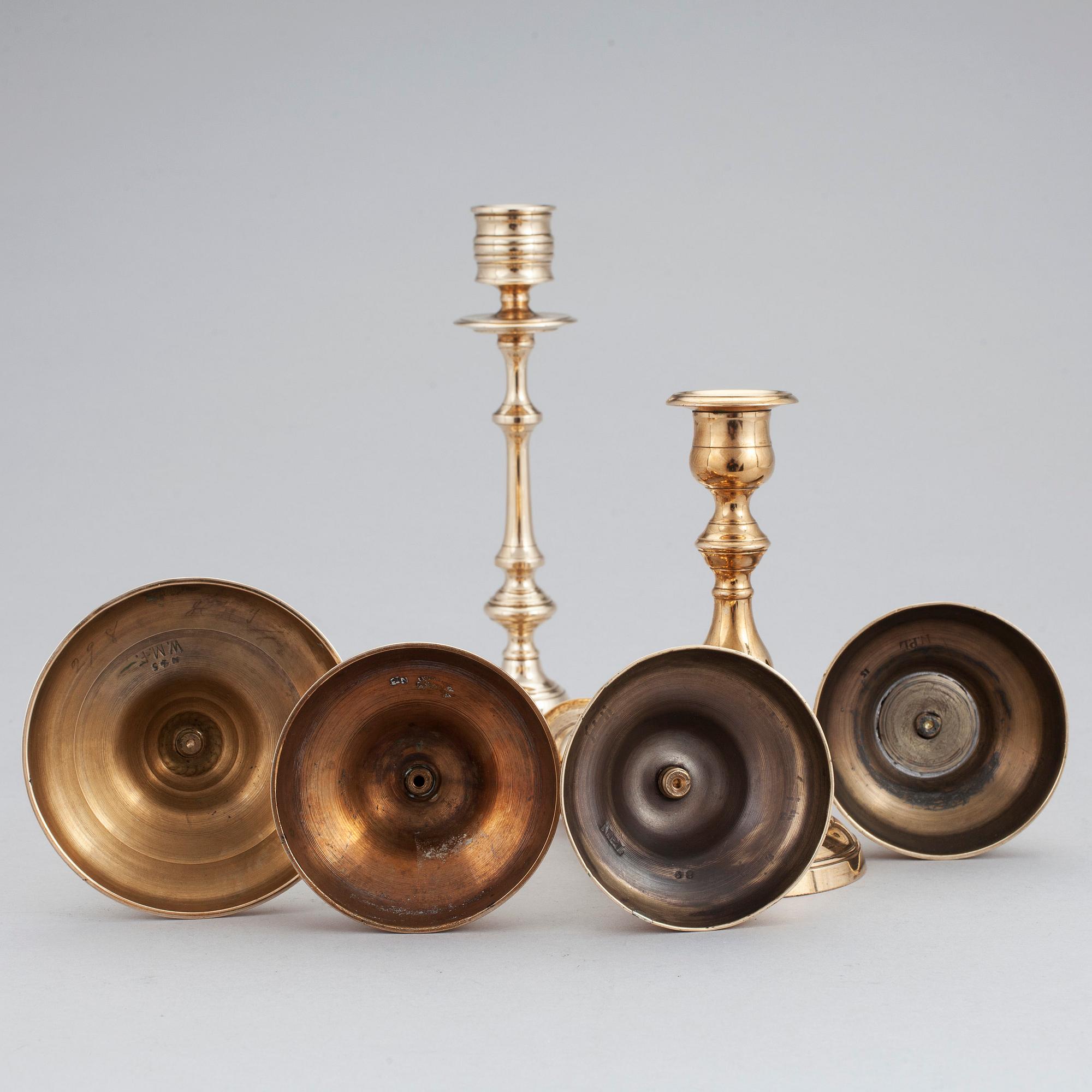 Three pair of candlesticks in brass, marked WMF, Westerås Metallfabrik and NLP. Late 19/early 20th century.