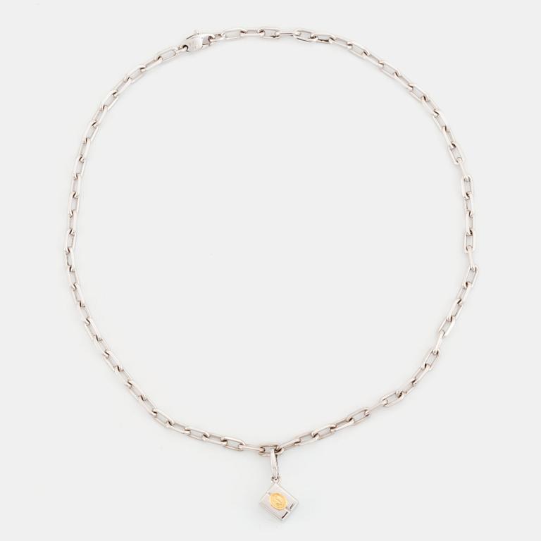 An 18K gold and white gold Cartier necklace with a charm.