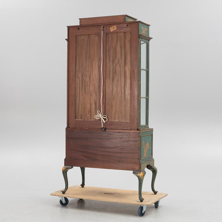 A display cabinet, England, early 20th Century.