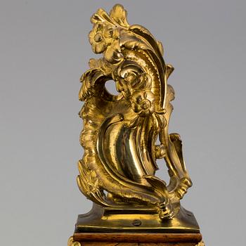 A Rococo/Rococo-style 18th/19th century mantel clock.