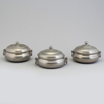 A set of three tin PORRIDGE BOWLS, 19th century.