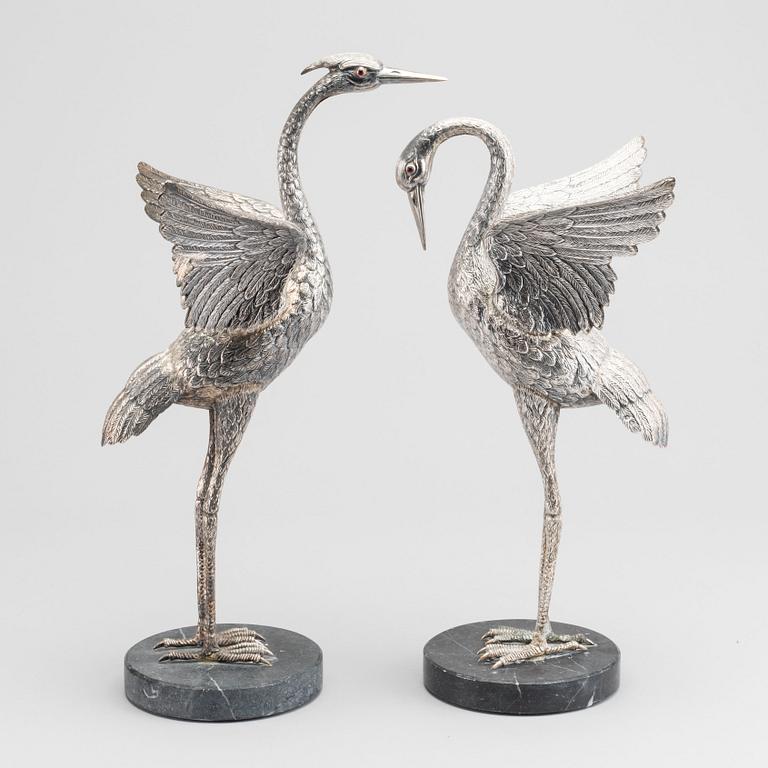 A pair of Spanish silver figurines, unmarked  receipt is included.