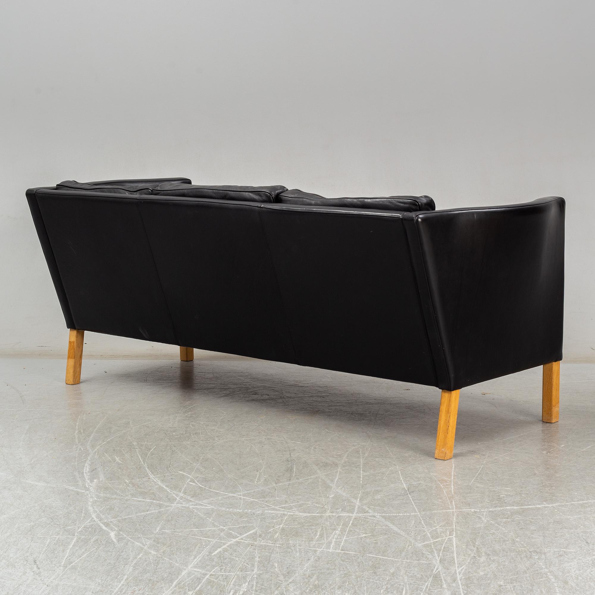An 'AV59' sofa by Arne Vodder, Nielaus, Denmark.