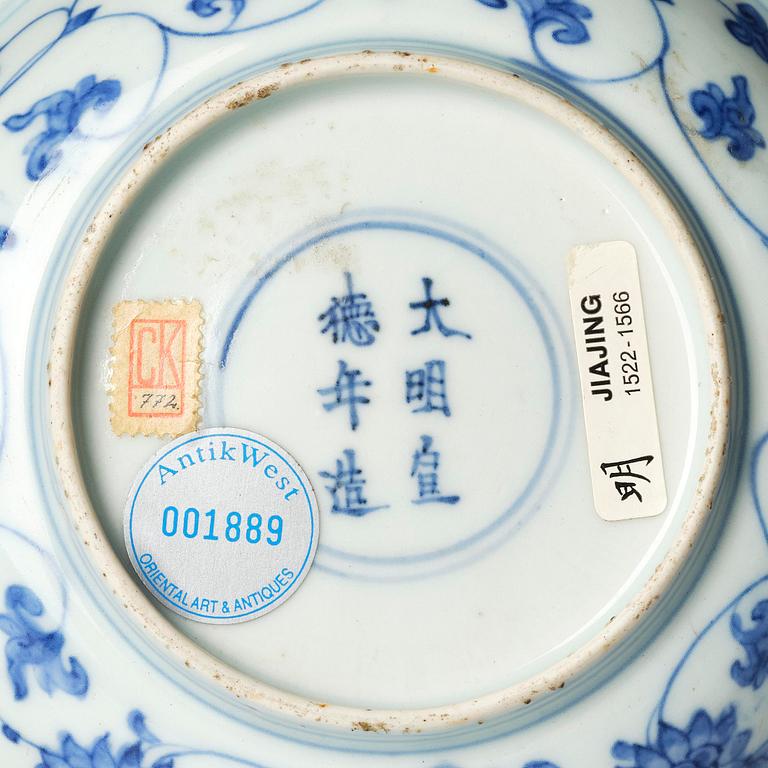 A blue and white dish, Ming dynasty, with a Jiajing mark.