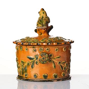 A glazed earthenware jar with cover, probably France, 19th century.