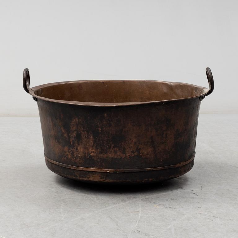 A 19th century copper cauldron.