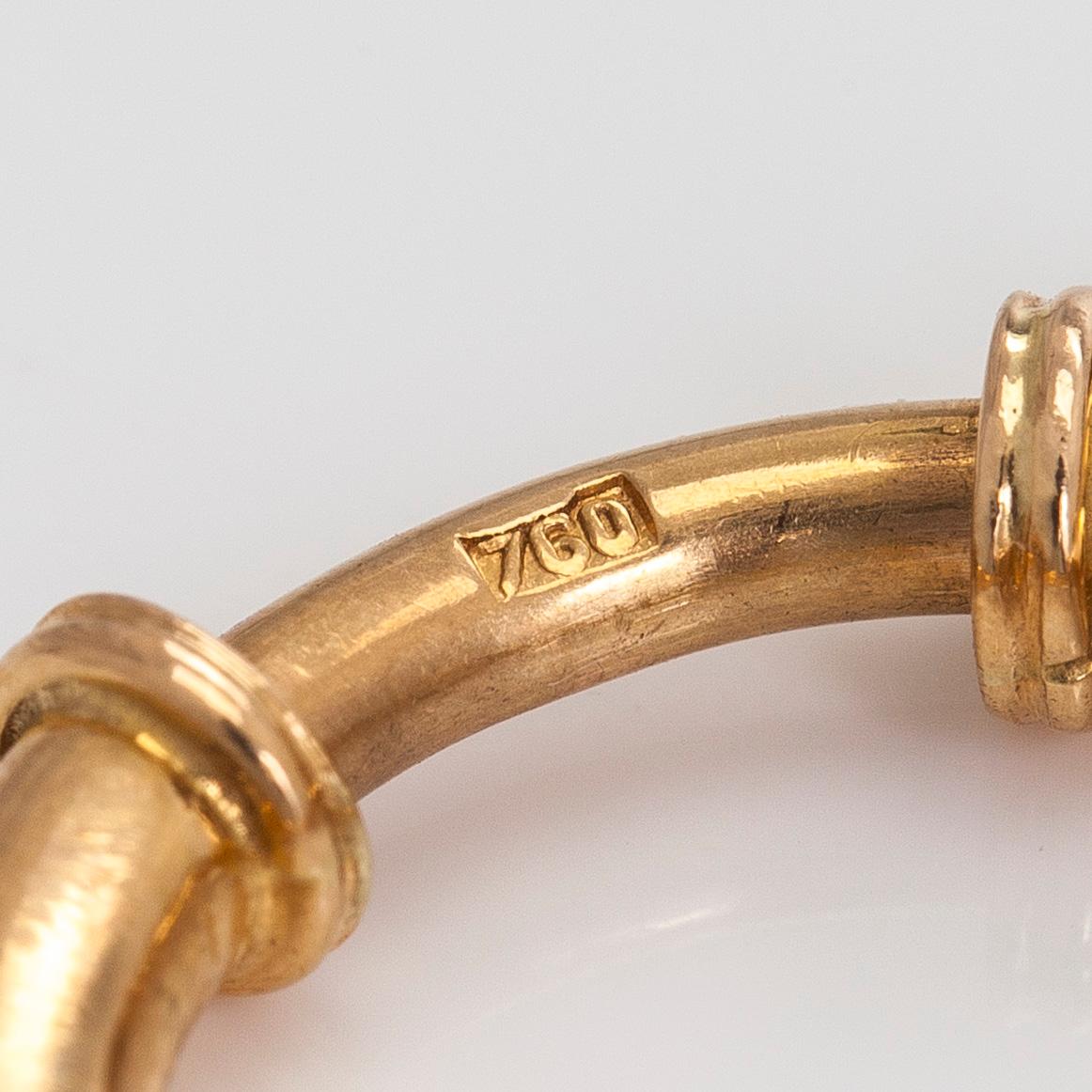 Kellovitja, 18K kultaa.