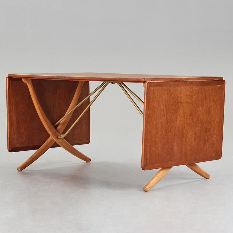 Hans J. Wegner, a teak, beech and brass dining table, model "AT-314", for Andreas Tuck, Denmark 1950-60's.