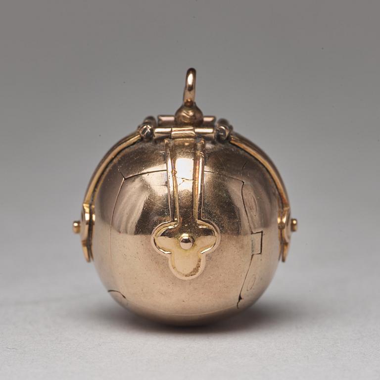 A gold and silver Masonic ball and cross pendent and a Freemason sign, unmarked c:a 1900.