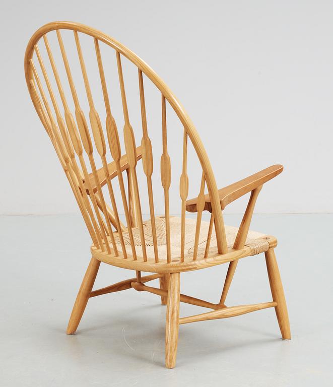 A Hans J Wegner ash and teak 'Peacock chair', Johannes Hansen, Denmark.