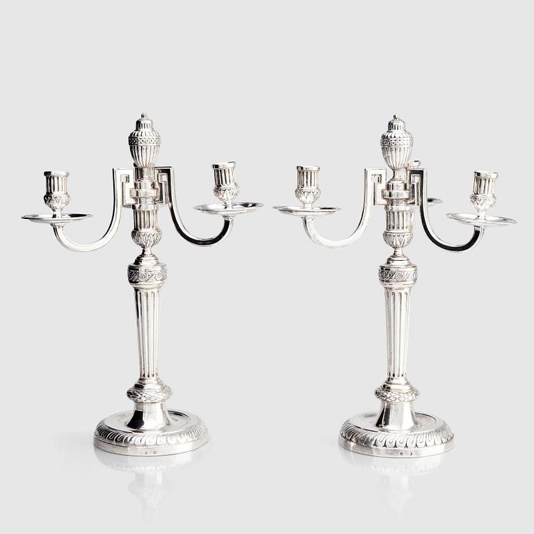 A pair of Austrian Royal, Three-armed silver candelabras, marks of lgnaz Joseph Würth, Vienna 1779.