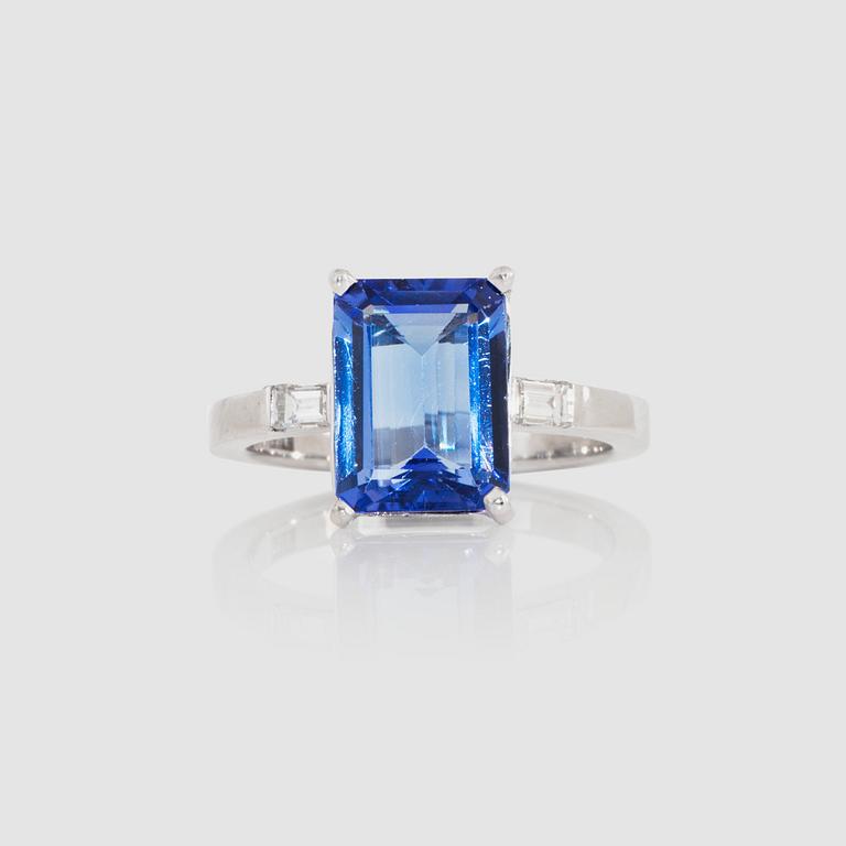 A 4.04 ct tanzanite ring set with diamonds, total carat weight 0.22 ct.