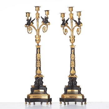 A pair of three-light Empire candelabra, early 19th century .