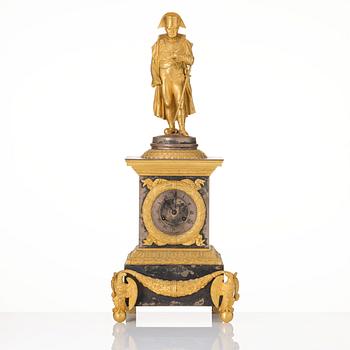 A French Empire ormolu and silvered bronze figural mantel clock, first part of the 19th century.