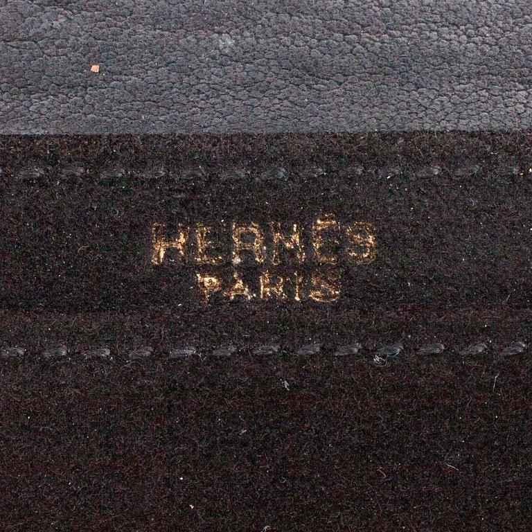 Hermès, HERMÈS, a black suede clutch, "L'officiel de la Mode".