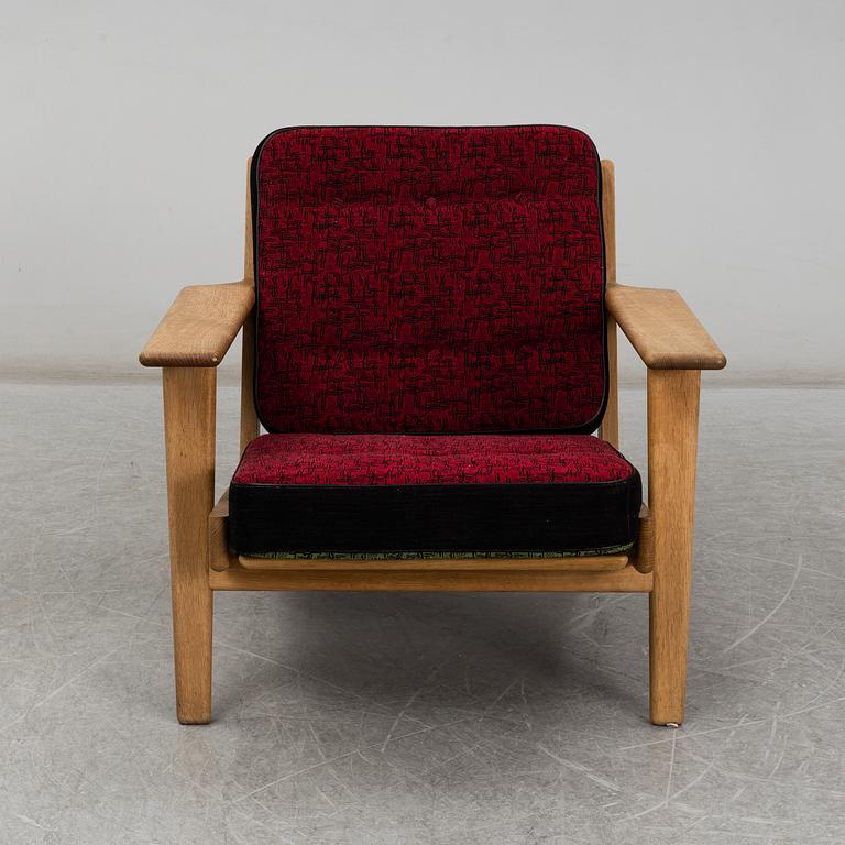HANS J WEGNER, a model GE-290 armchair by Gedsted, Denmark.