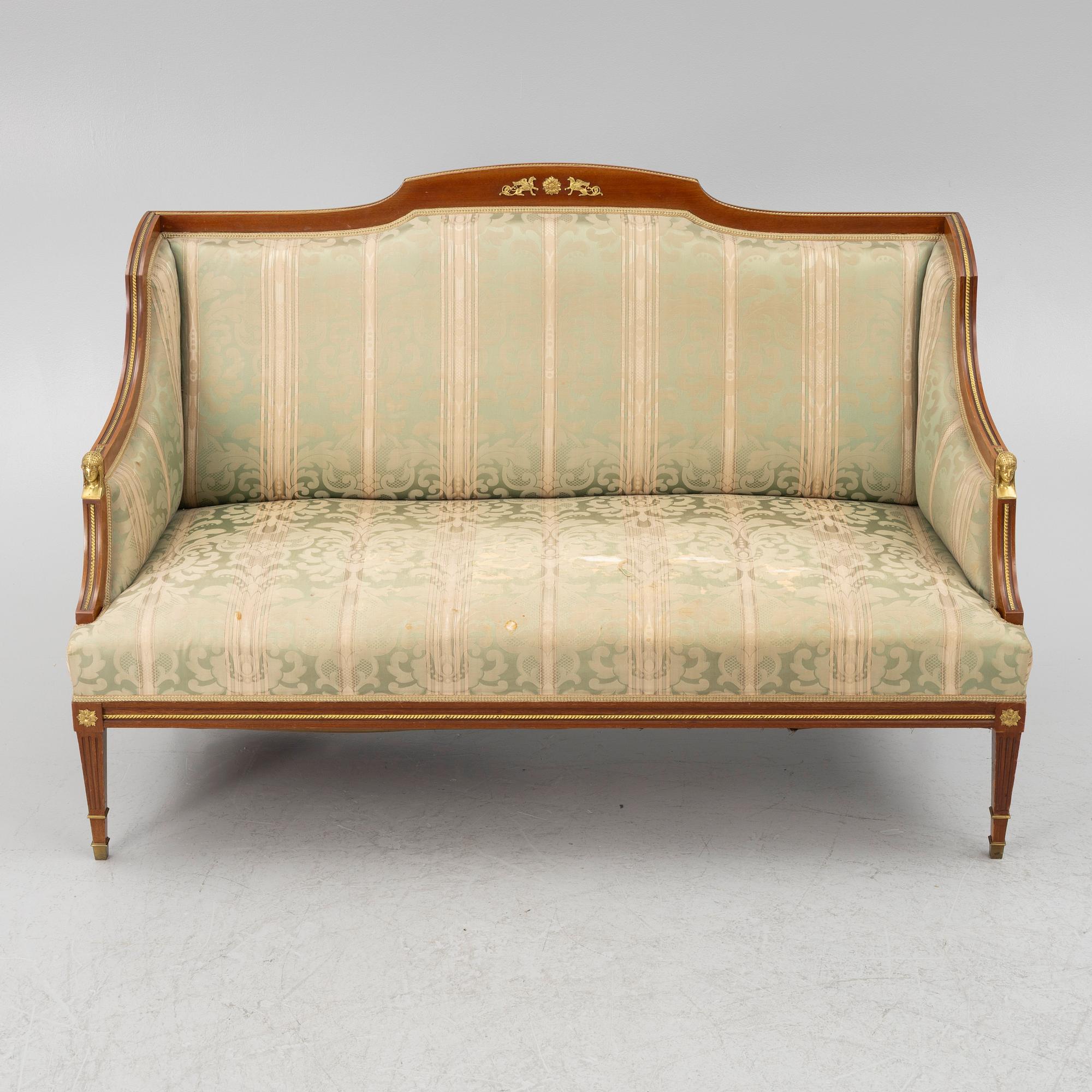 A sofa, two armchairs, four chairs and table, Empire style, 20th century.