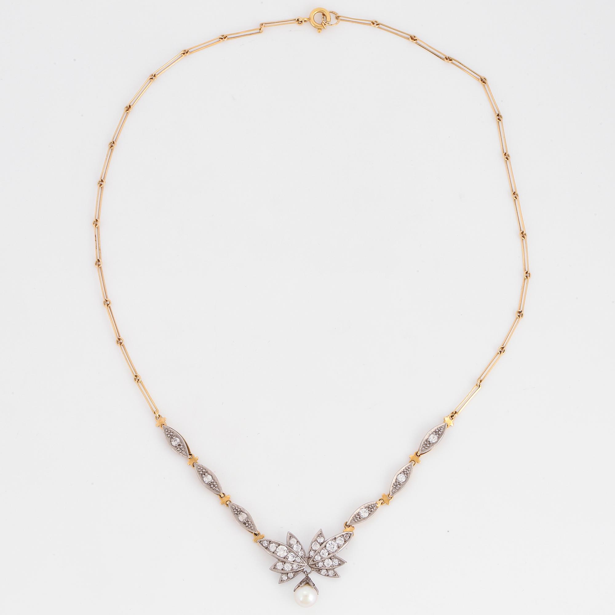 18K gold necklace with white stones and pearl.