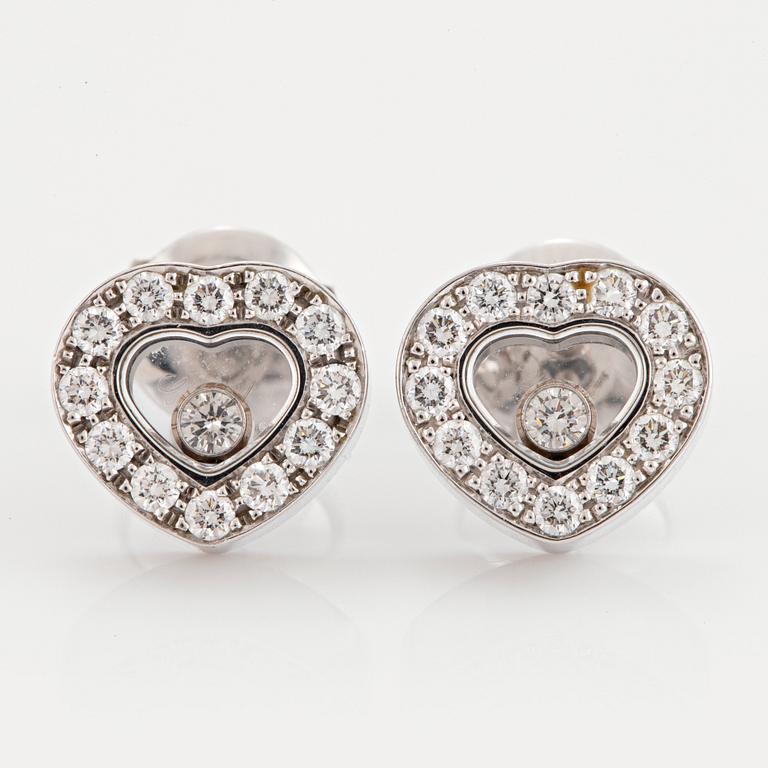 A pair of Chopard "Happy Diamonds" earrings in 18K gold set with round brilliant-cut diamonds.