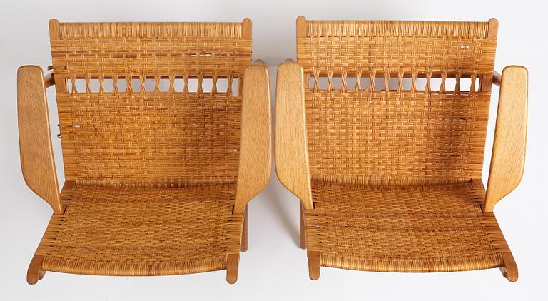 Hans J. Wegner, a pair of oak and rattan 'CH-27' chairs, Carl Hansen & Son, Denmark.