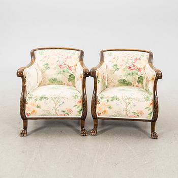 A pair of stained birch 1940s armchairs.