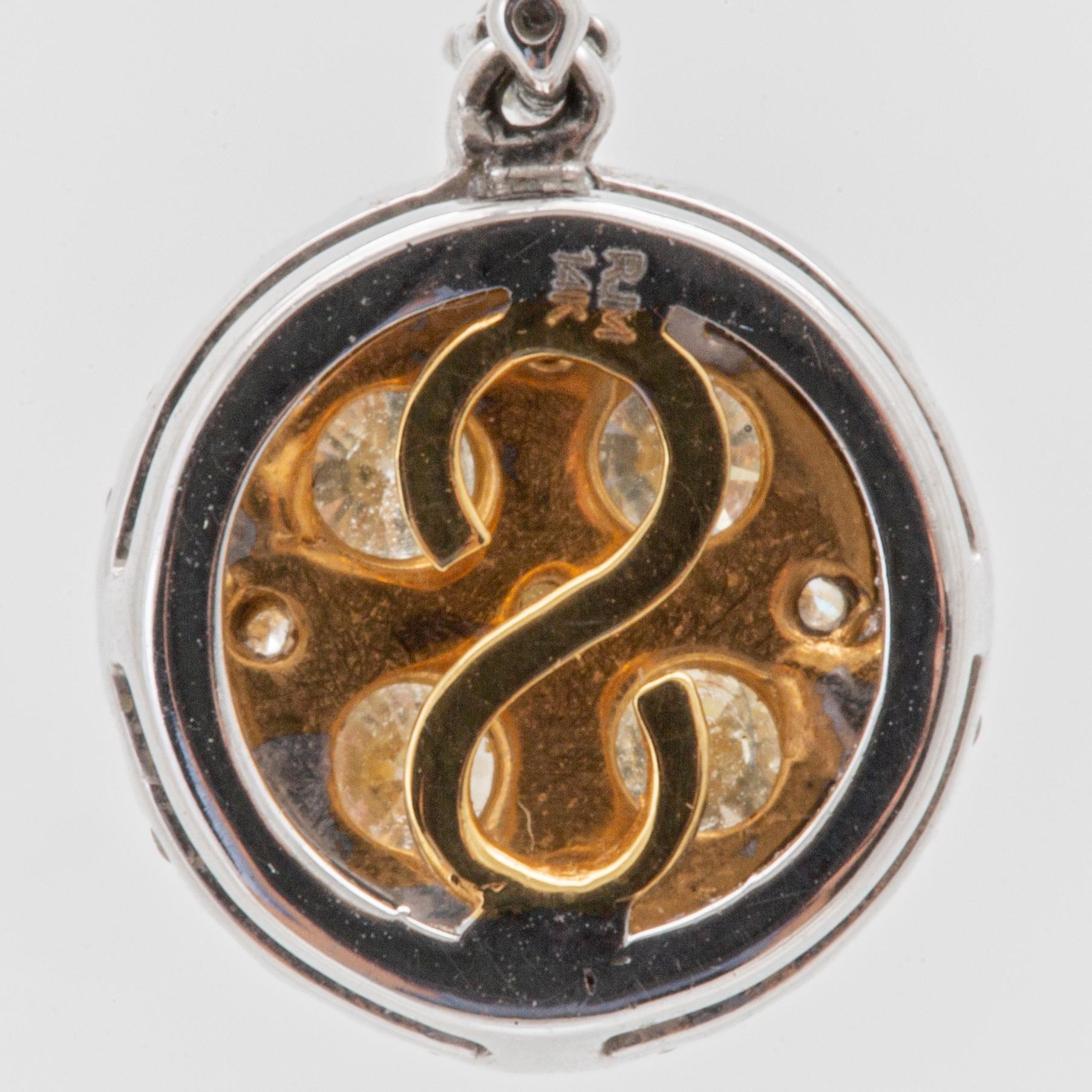 Earrings in 14K white and red gold with round brilliant-cut diamonds.