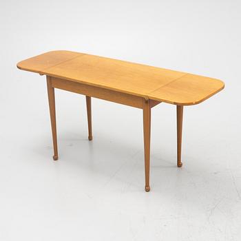 Josef Frank, a model 1007 mahogany drop leaf table, Svenskt Tenn, Sweden, second part of the 20th Century.