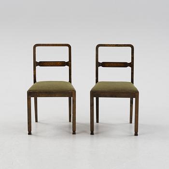 A Swedish Grace birch dining table and four chairs, 1920's/1930's.