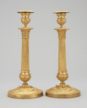 A pair of French Empire early 19th century candlesticks.