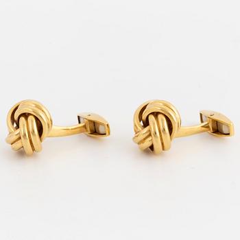 18K gold knot-shaped cufflinks.