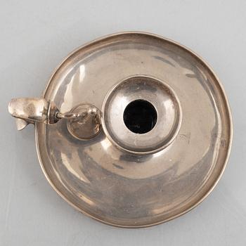 A silver chamber candlestick with mark of R & S Garrard & Co, London, England 1848.