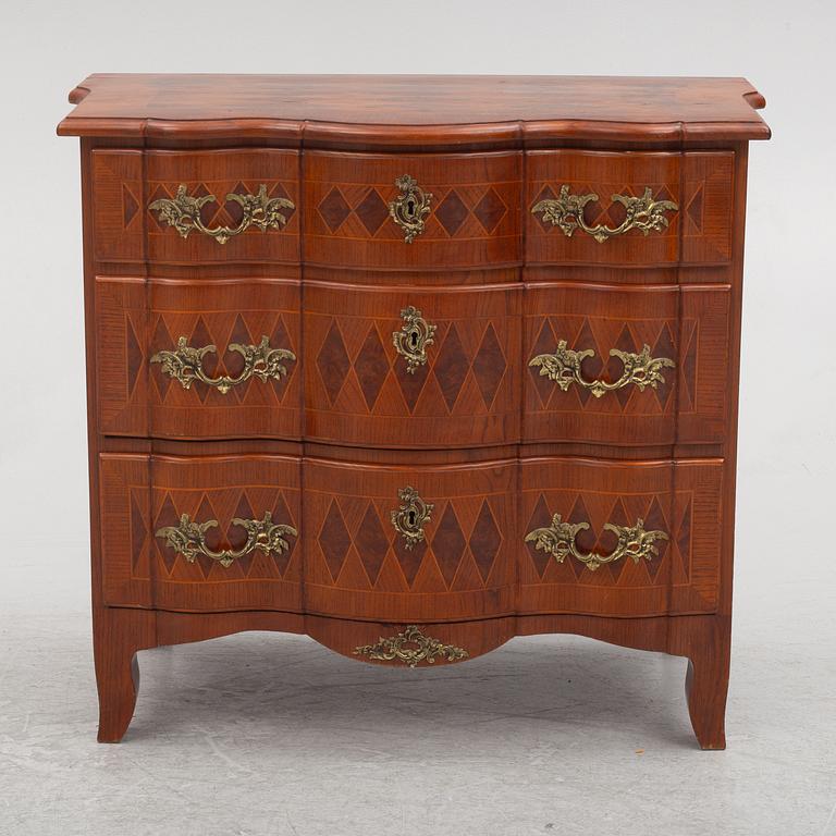 A Baroque style chest of drawers, circa 1900.