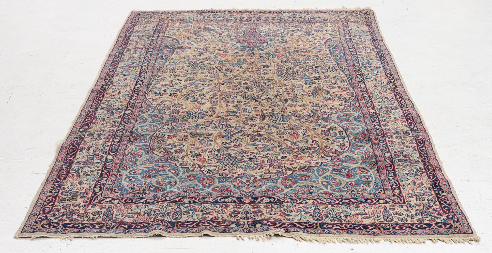 A semi antique Kirman rug, South Persia, c. 228 x 136 cm.