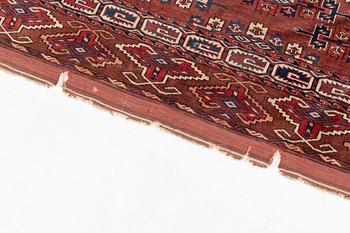 An antique Youmut main carpet, c. 330 x 183 cm.
