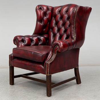 A late 20th Century leather easy chair.