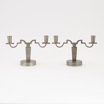 Firma Svenskt Tenn, a pair of pewter two-light candelabra, Stockholm, 1932.