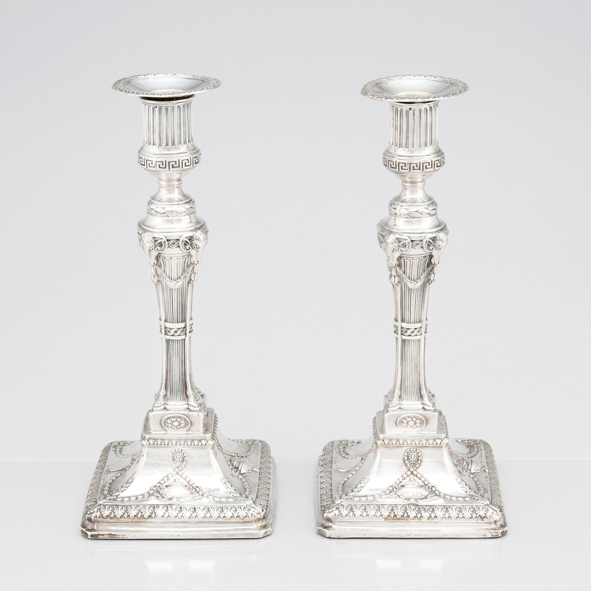 An English pair of 18th Century silver candlesticks, mark of John Winter & Co, Sheffield 1775.