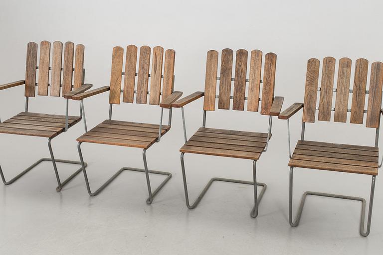 A GARDEN TABLE AND FOUR ARMCHAIRS FROM GRYTHYTTAN.