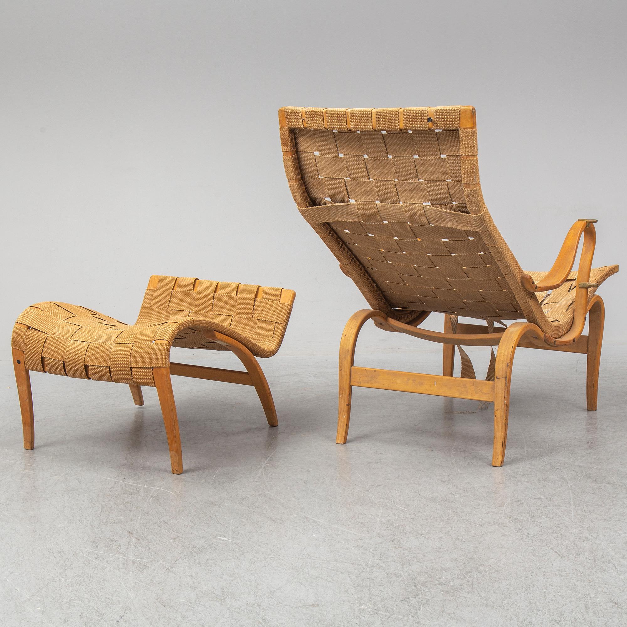 An mid 20th Century easy chair  and stool by Bruno Mathsson for Karl Mathsson Värnamo.