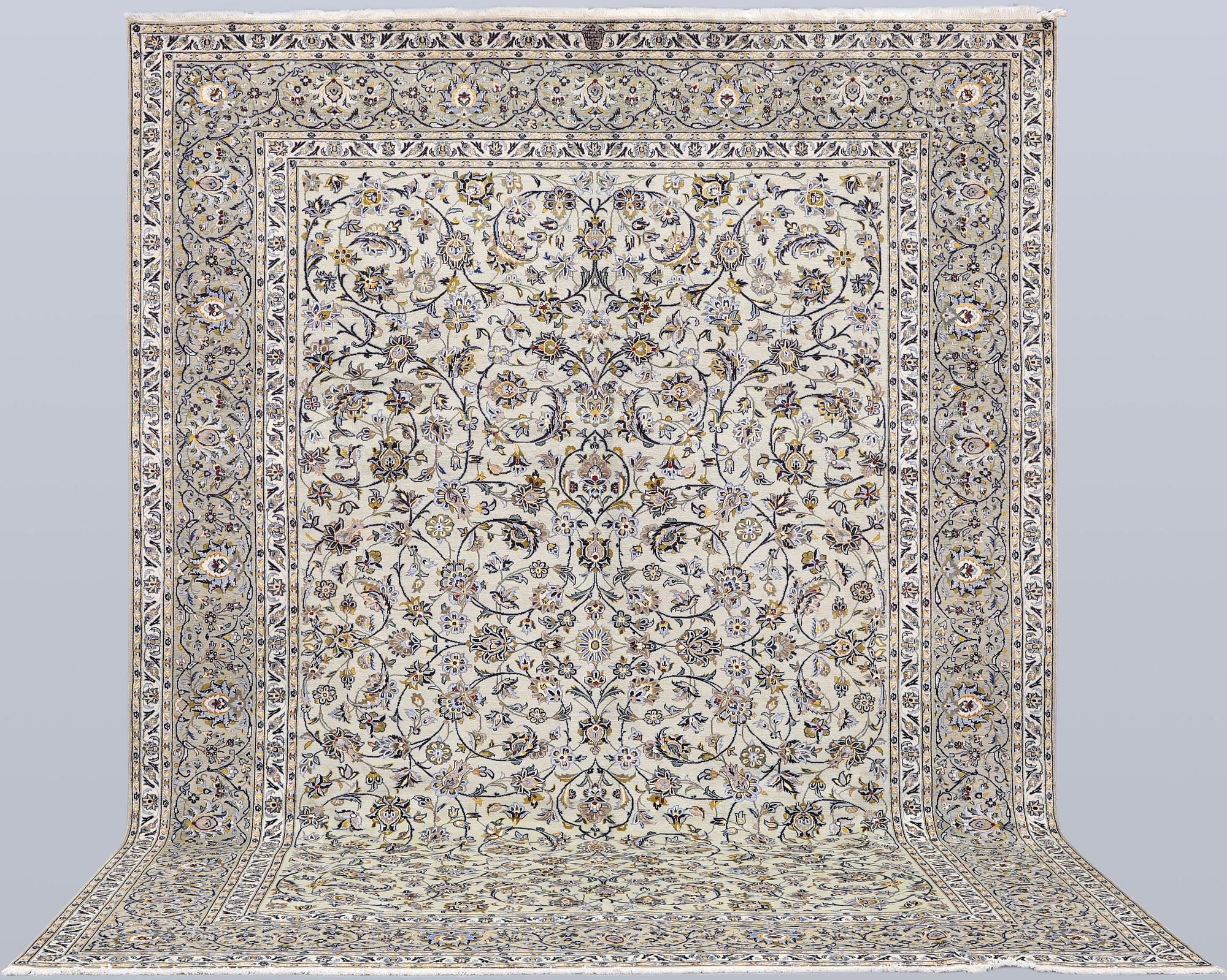 A Keshan carpet, signed, 397 x 302 cm.