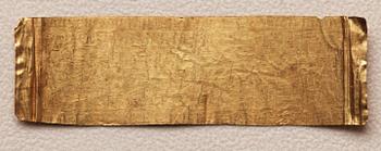 A set of nine presumably modern Egyptian-style gold foil sheets with figures and hieroglyphs.
