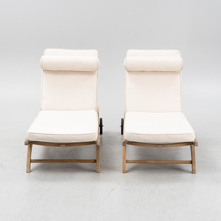 A pair of 'Columbus Sunbed' teak deck chairs, Skagerak, Denmark.